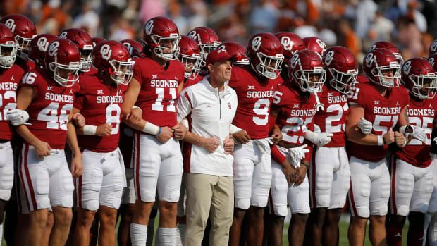 Oklahoma Sooners head coach Brent Venables lines up with his team before the Red River Showdown college football game between the University of Oklahoma (OU) and Texas at the Cotton Bowl in Dallas, Saturday, Oct. 8, 2022. Texas won 49-0.